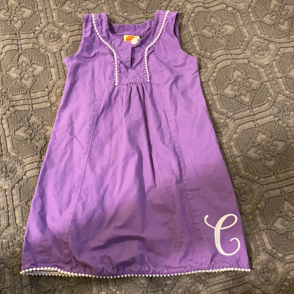Purple dress with embroidered C